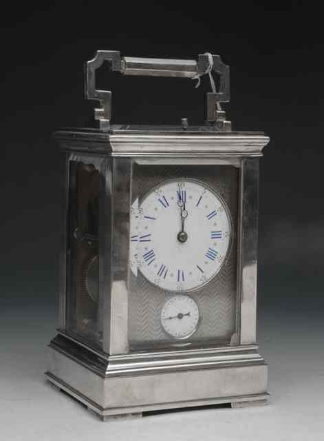 Appraisal: A SILVER PLATED CARRIAGE CLOCK with loop handle and painted