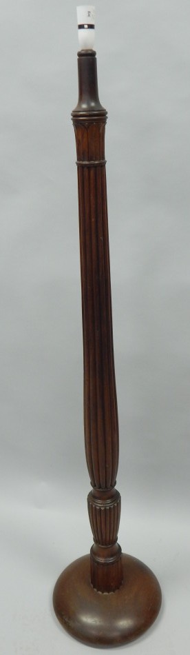 Appraisal: A mahogany standard lamp with a reeded leaf carved column