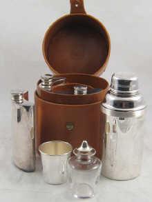 Appraisal: A sporting gentleman's drinks canteen comprising three spirit flasks a