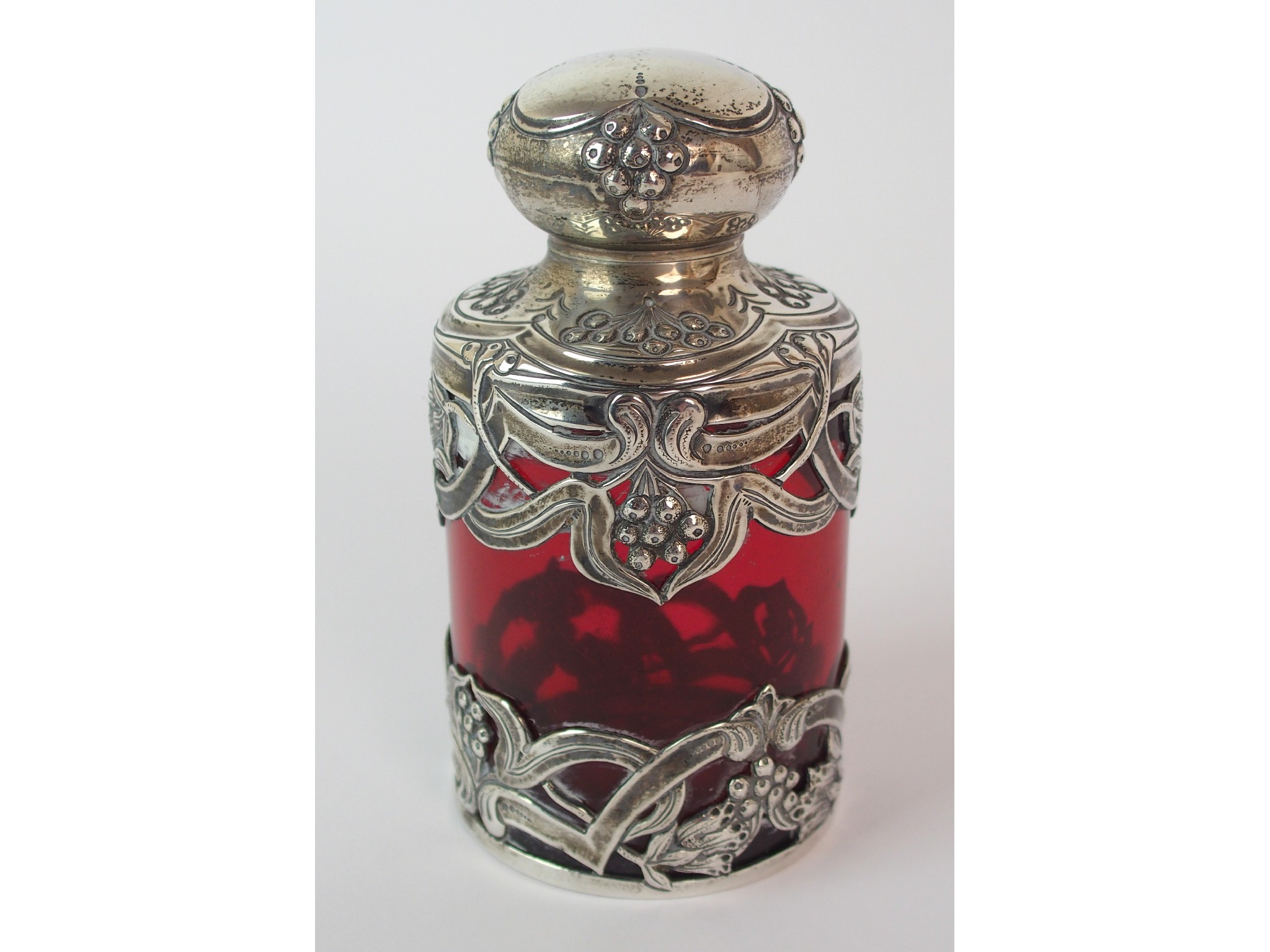 Appraisal: An Edwardian silver mounted cranberry glass scent bottleby John Grinsell