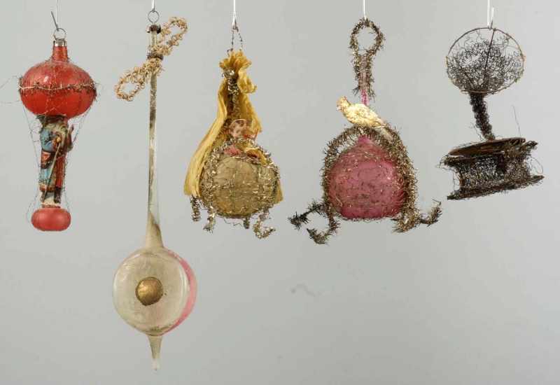 Appraisal: Lot of Wire Tinsel Ornaments Description Includes one doll carriage