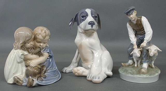 Appraisal: - Three Royal Copenhagen porcelain figures including a seated puppy