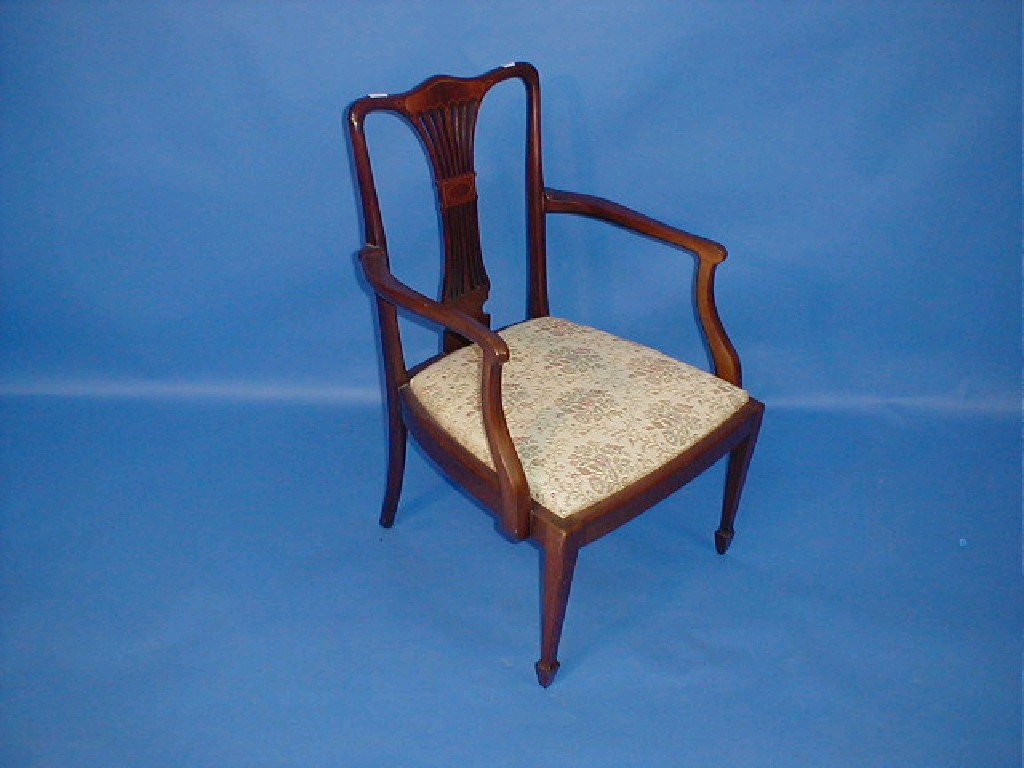 Appraisal: An Edwardian string inlaid mahogany salon chair with pierced splat