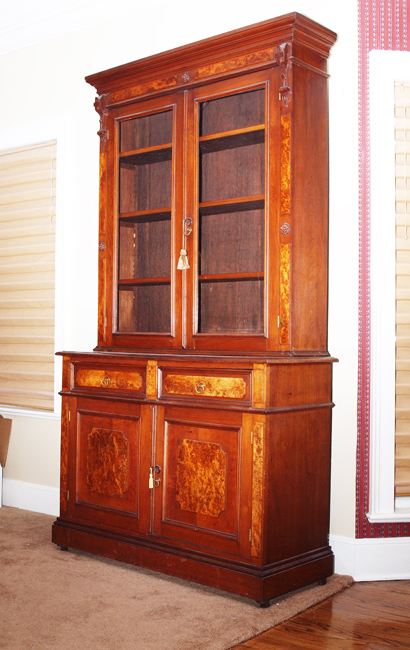 Appraisal: VICTORIAN BURL WALNUT BOOK CASE Applied carved decoration with burl