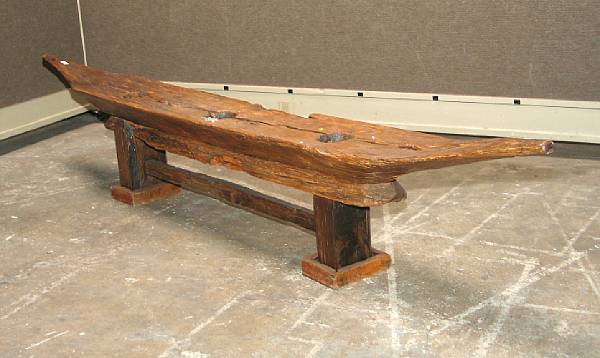 Appraisal: A massive Asian wood boat-shaped trough With three apertures carved