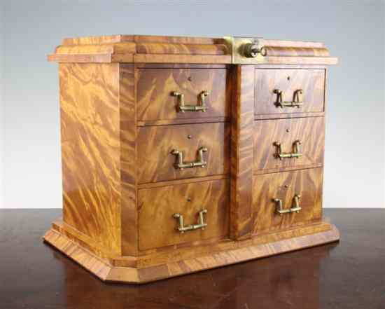 Appraisal: A Victorian satinbirch table top Wellington type chest with locking