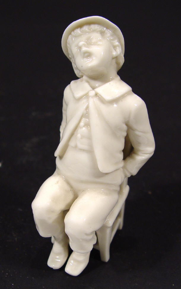 Appraisal: Royal Worcester style porcelain figure of a boy on a