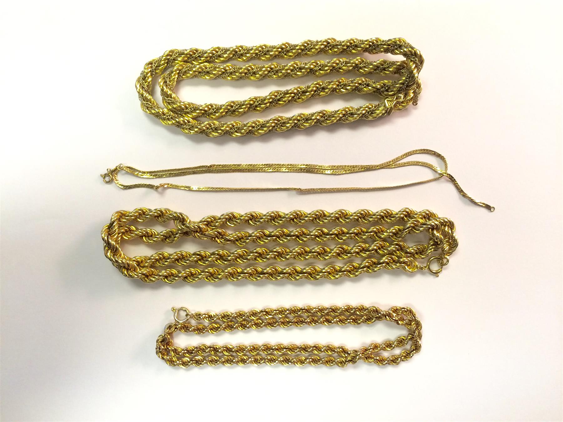 Appraisal: FOUR GOLD CHAINS Two k hollow rope twisted k twisted