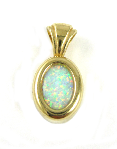 Appraisal: OPAL AND FOURTEEN KARAT GOLD PENDANT with a bezel set