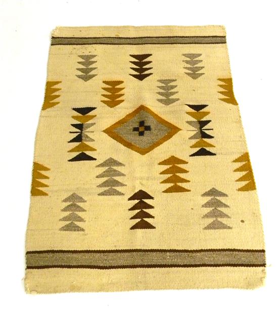 Appraisal: Navajo rug geometric patterns in ochre tan and dark brown