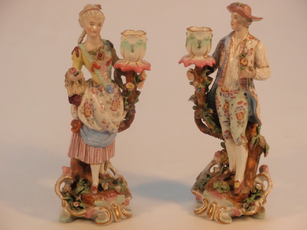 Appraisal: A pair of Meissen figural candlesticks each bearing a single