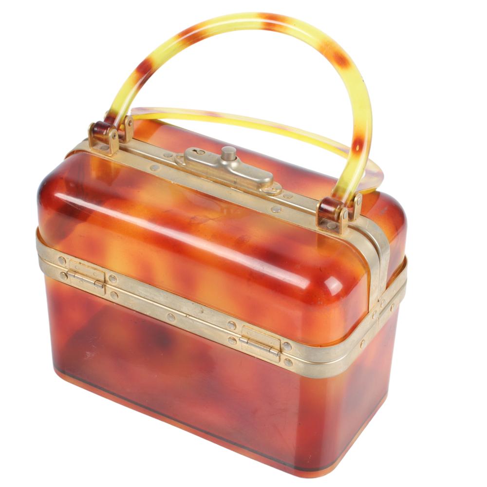 Appraisal: LIGHTER TORTOISE PLASTIC DOUBLE HANDLED SUITCASE HANDBAG H X W