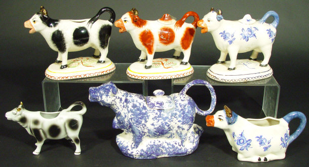 Appraisal: Six Staffordshire china cow creamers four on floral moulded bases