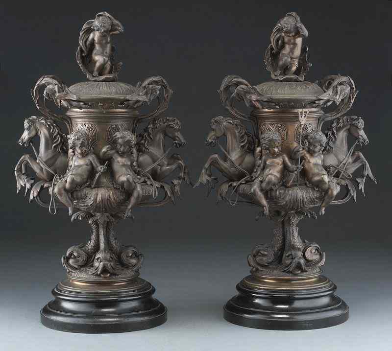 Appraisal: Pr French bronzed spelter figural urns surmountedby a putto in