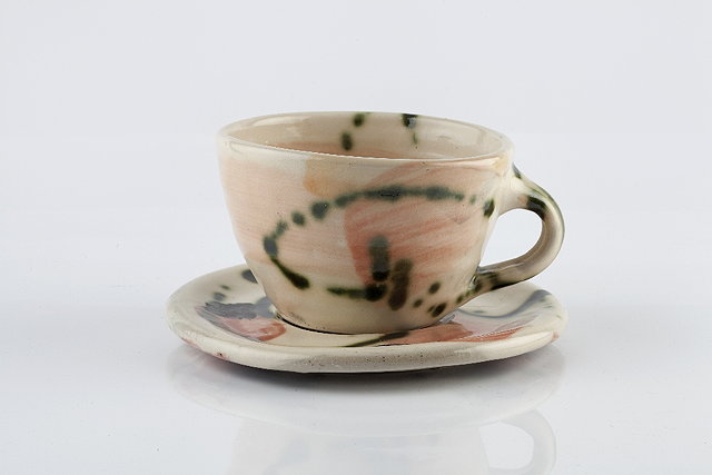 Appraisal: Sandy Brown British b Tea cup and saucerpainted and dripped