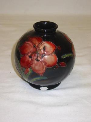 Appraisal: A WALTER MOORCROFT FLAMBE POTTERY VASE of globular form tube