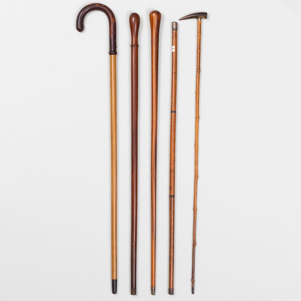 Appraisal: Group of Five Walking Sticks Comprising Two hardwood sticks A