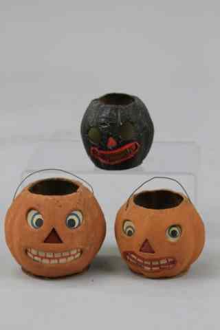 Appraisal: THREE SMALL JACK-O-LANTERNS Germany pressed cardboard includes two paper face