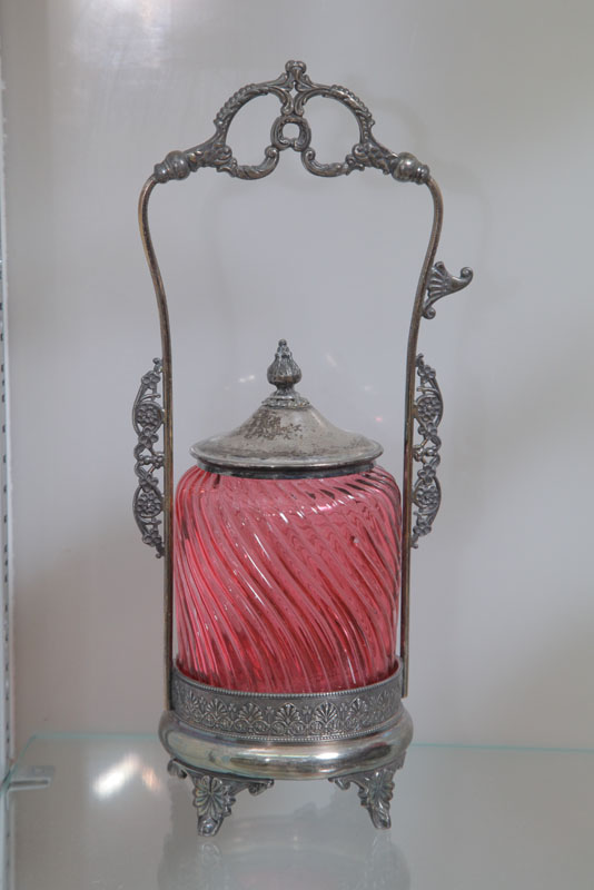 Appraisal: PICKLE CASTOR Cranberry swirl insert in a silver plated holder