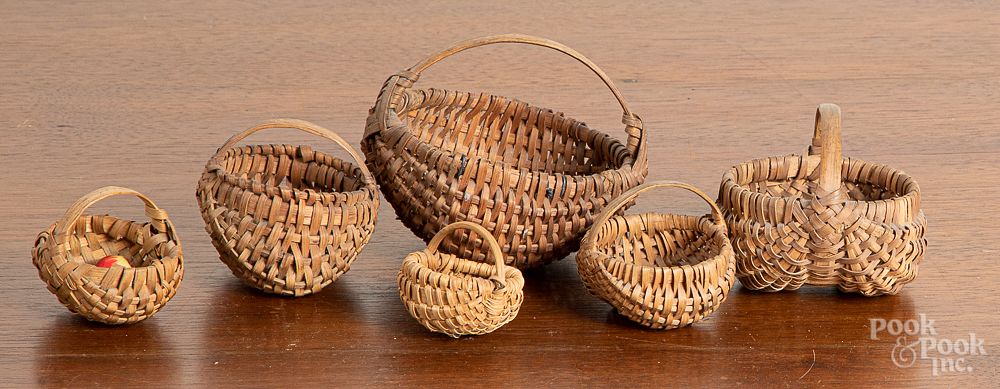 Appraisal: Six miniature baskets Six miniature baskets largest - h dia