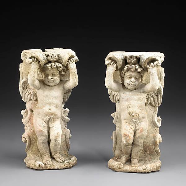 Appraisal: A pair of Baroque style cast stone garden putti first