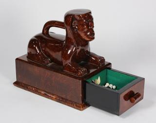 Appraisal: Continental burlwood carved wood sphinx form box with hidden drawer