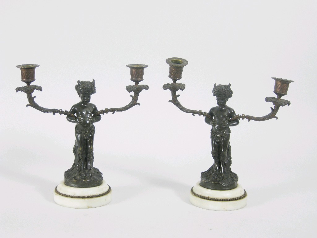 Appraisal: After CLODION Pair of bronze two branch Candelabra each in