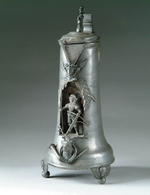 Appraisal: INTERESTING DECORATED PEWTER FLAGON The tapered body supported by three