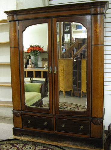 Appraisal: AN EDWARDIAN INLAID MAHOGANY WARDROBE English c The wardrobe is