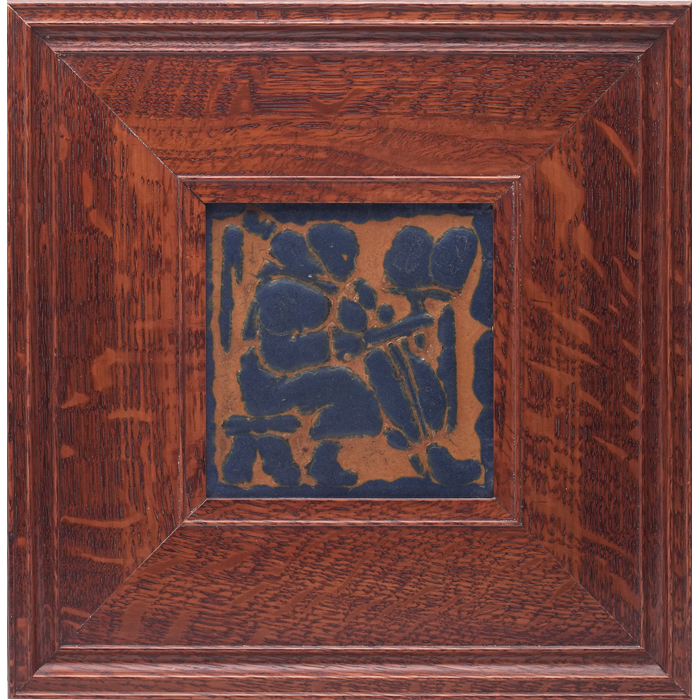 Appraisal: Grueby tile stylized figure in blue against a brown background