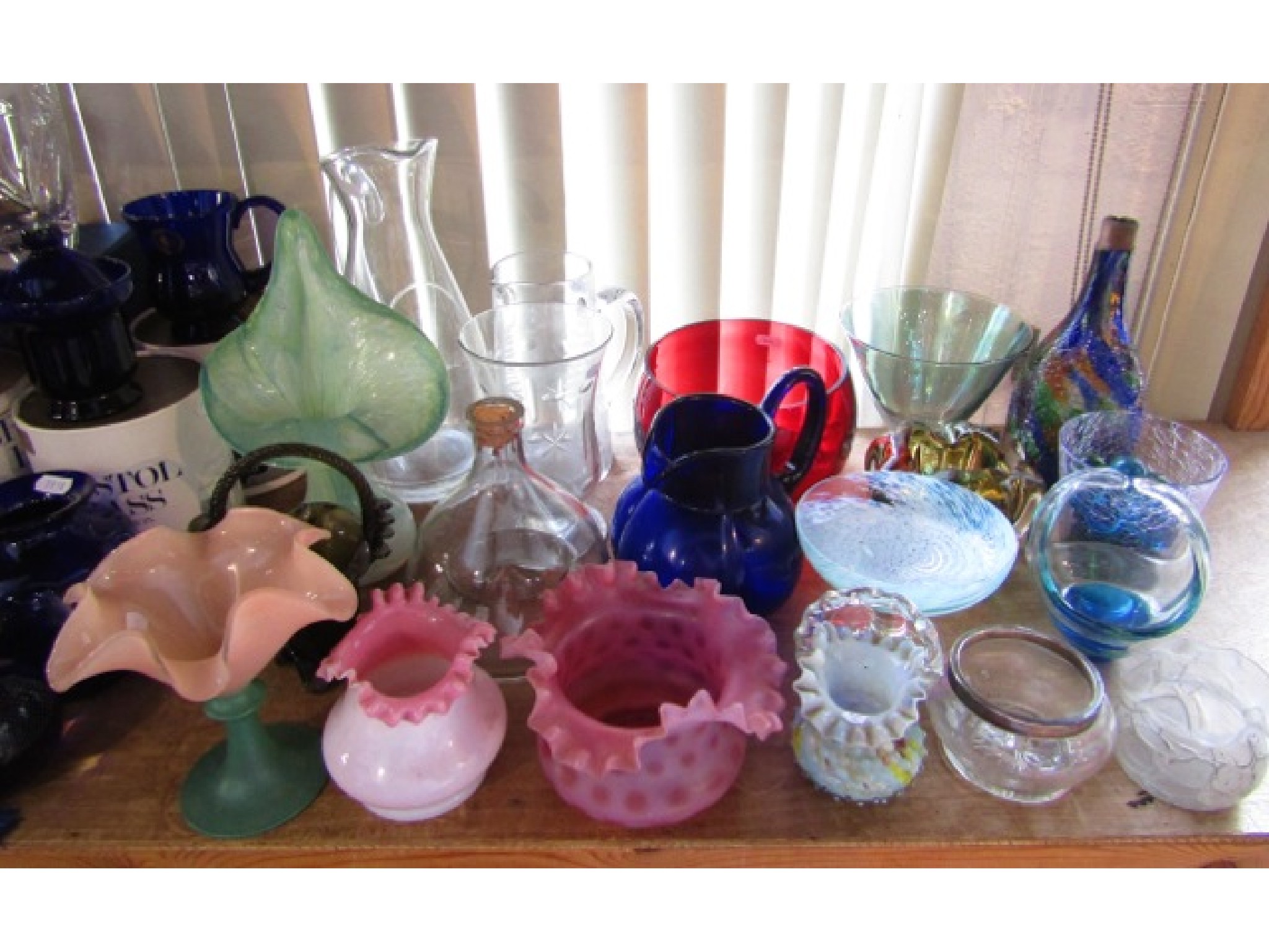 Appraisal: A collection of decorative coloured glass to include a Jack