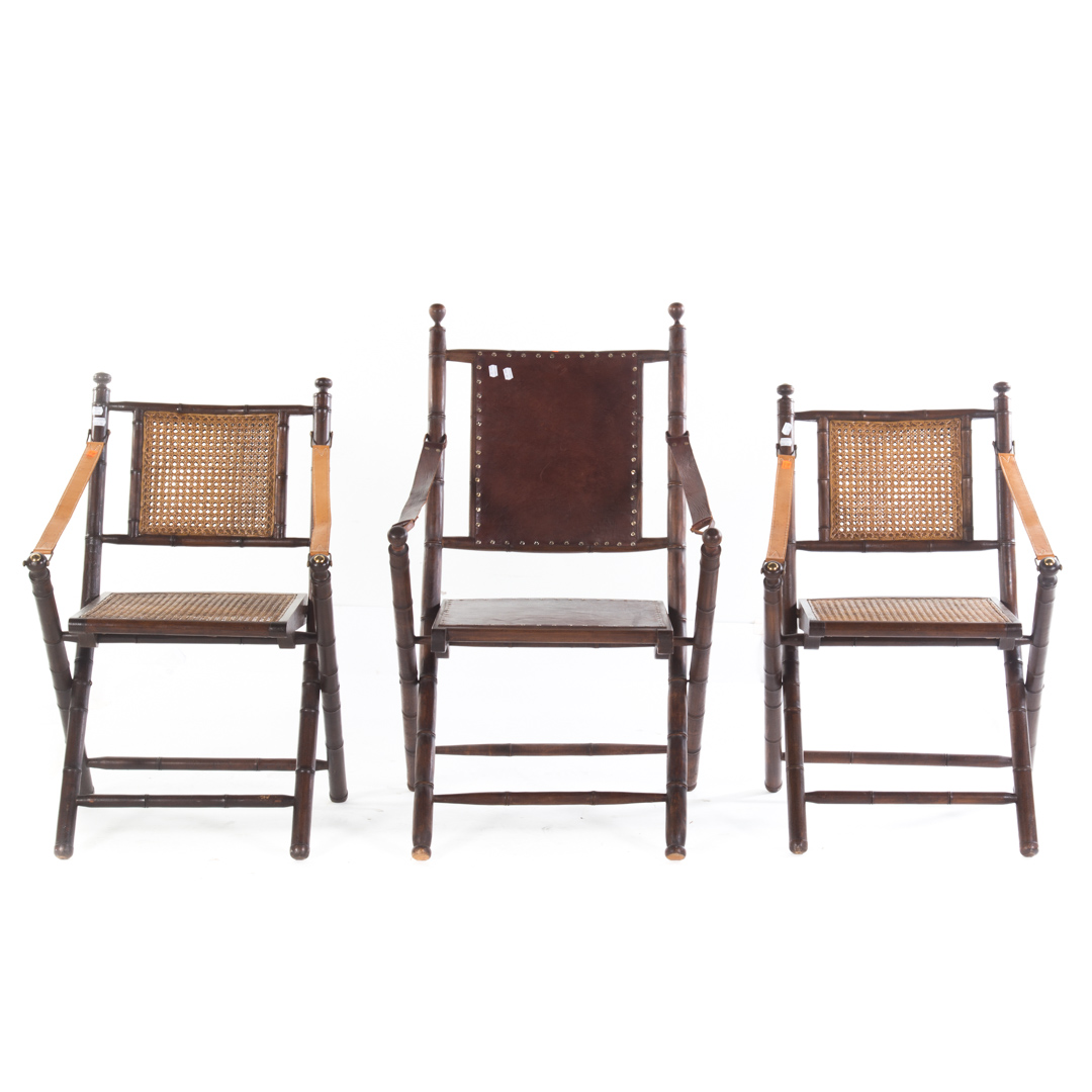 Appraisal: Anglo-Indian Campaign style folding chairs pair with caned seat and