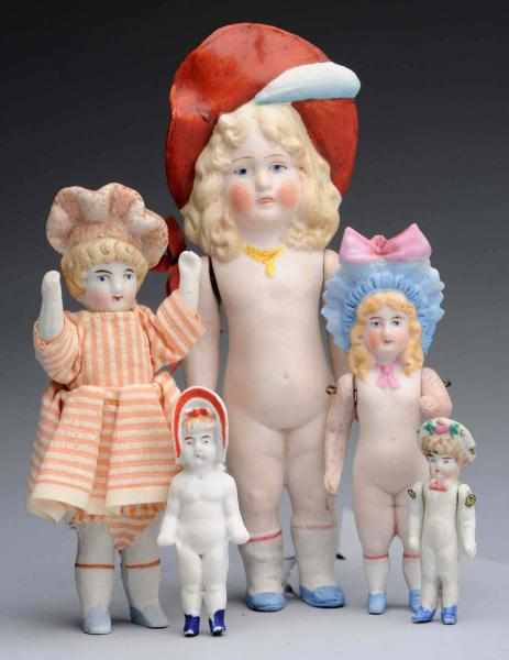 Appraisal: Lot of All-Bisque Dolls German bonnet dolls Girl with molded