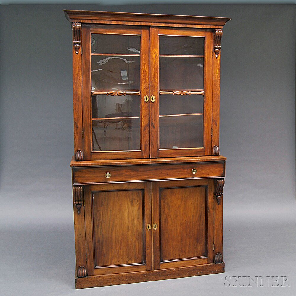 Appraisal: Victorian Walnut Two-part Glazed Cupboard America late th century the