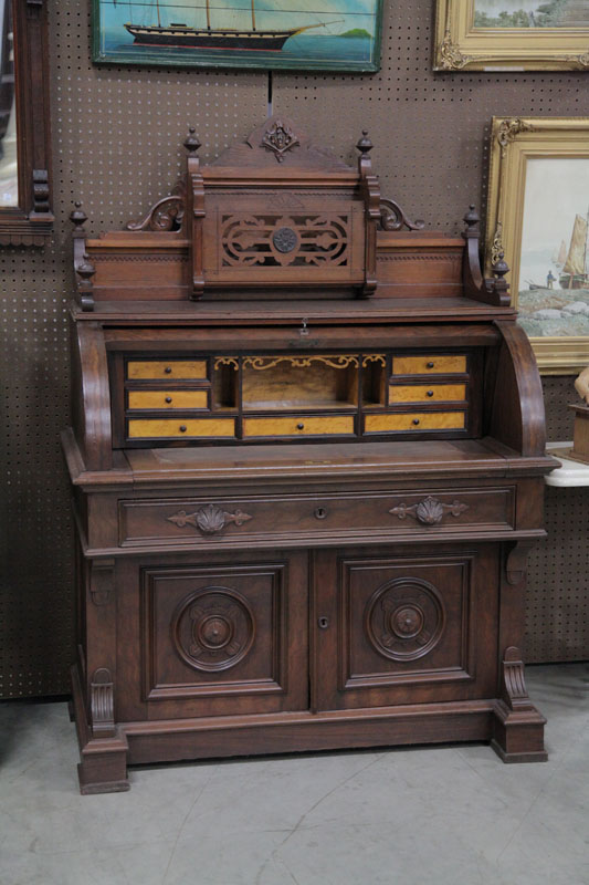 Appraisal: VICTORIAN ROLL TOP DESK Walnut and mahogany having a carved