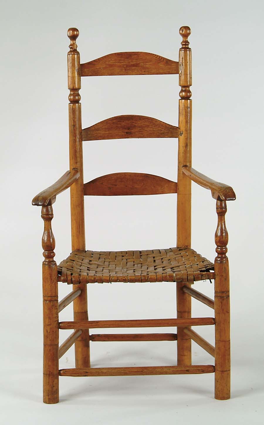 Appraisal: EARLY LADDERBACK ARMCHAIR th Century Three shaped horizontal slats turned