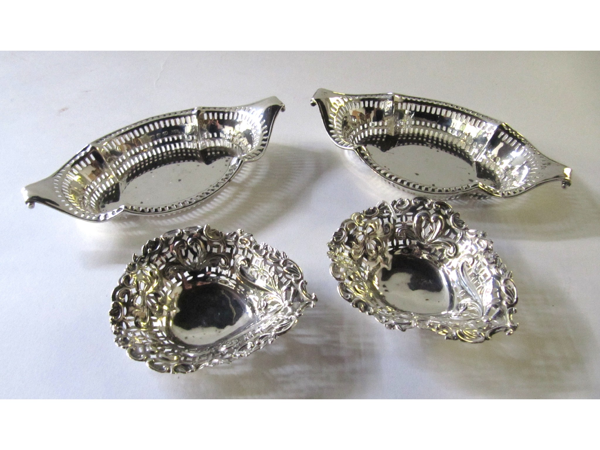 Appraisal: A lot comprising two pairs of silver bon bon dishes