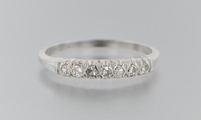 Appraisal: A Platinum and Diamond Band Platinum band set across the