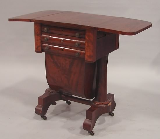 Appraisal: Walnut dropleaf two-drawer over sewing basket Cheval style double pedestal