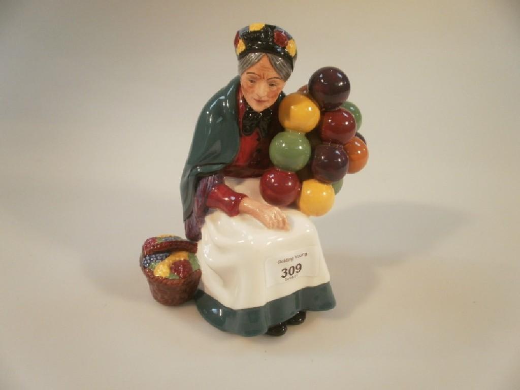 Appraisal: A Royal Doulton figurine of the 'Old Balloon Seller' HN