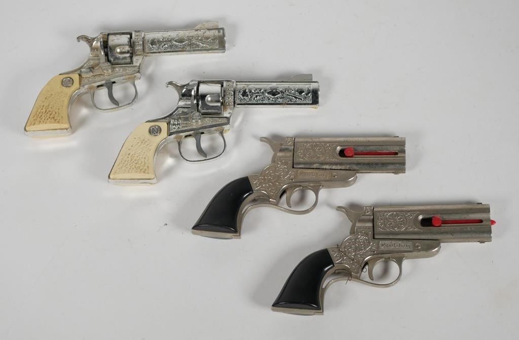 Appraisal: FOUR MID-CENTURY TOY CAP GUNSVintage children's Western style toy revolvers