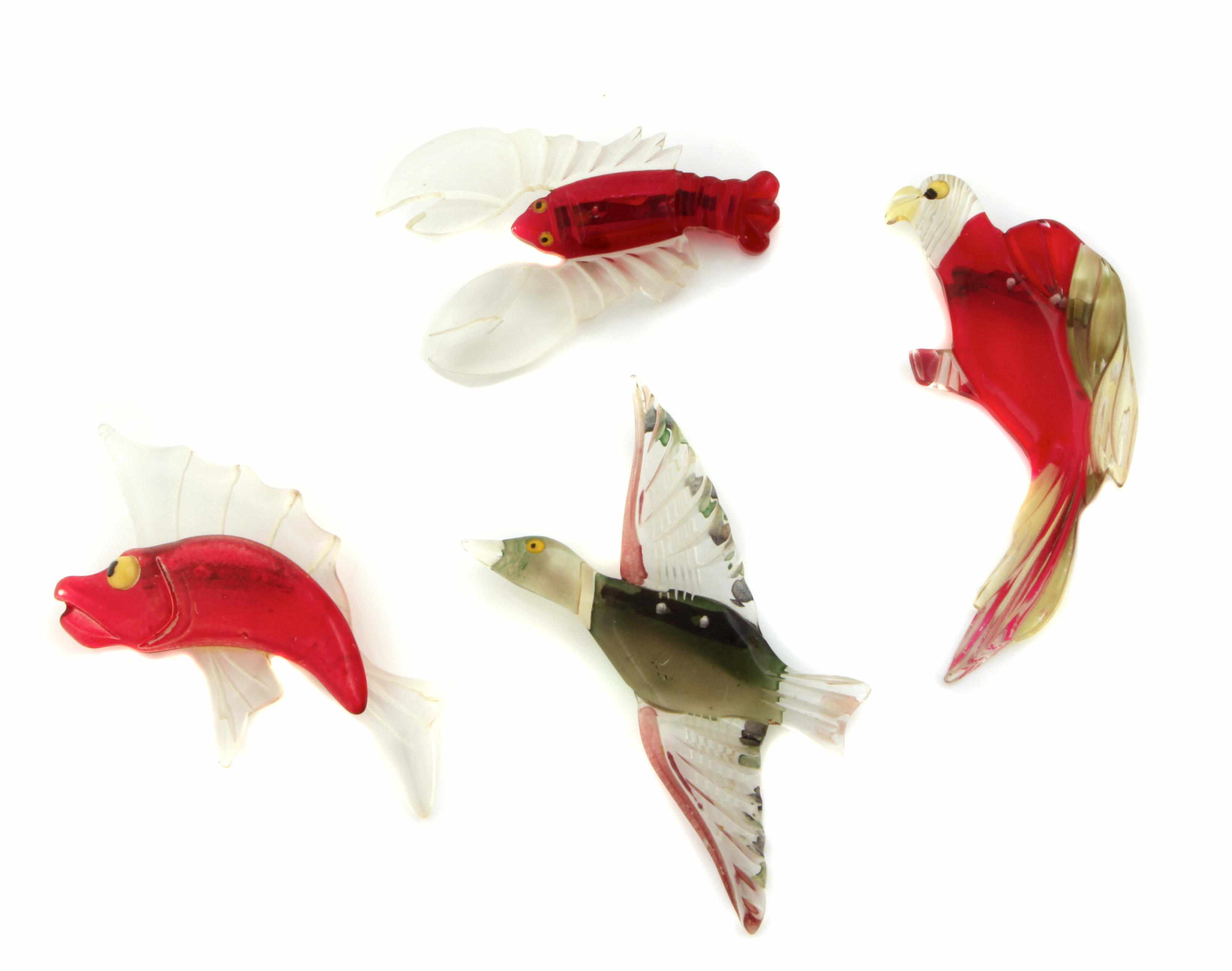 Appraisal: Four dyed lucite figural brooches lobster fish parrot and duck