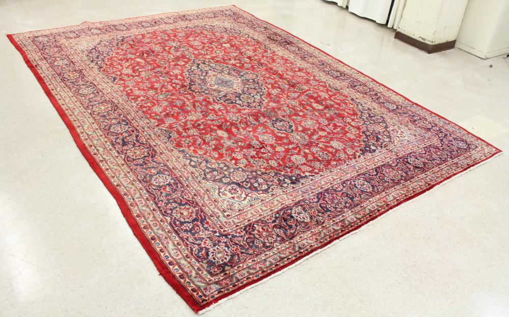 Appraisal: HAND KNOTTED PERSIAN CARPET floral and central floral medallion design