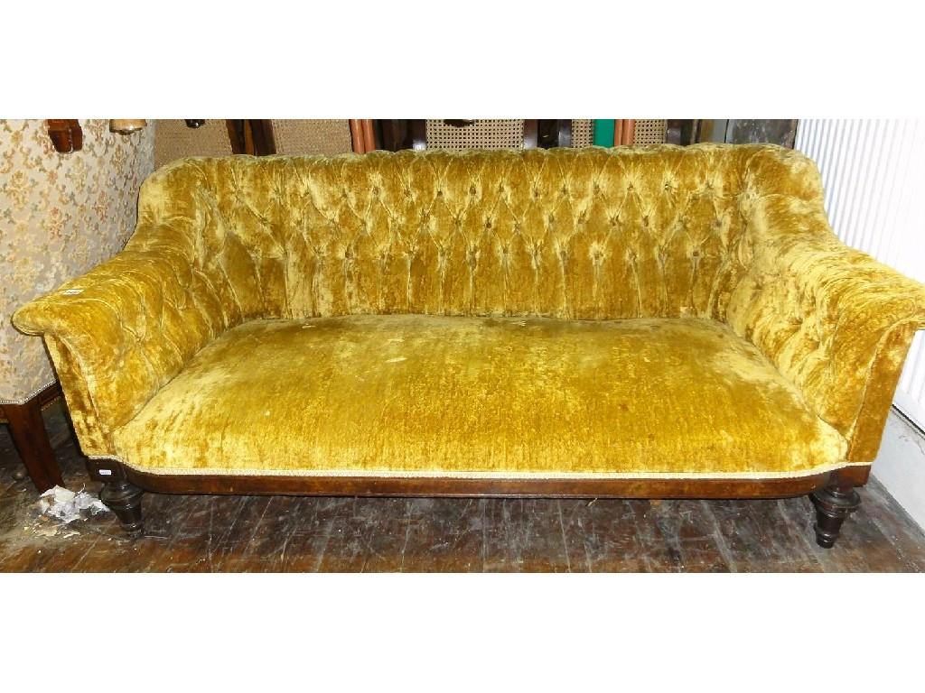 Appraisal: A Victorian couch with crushed yellow velvet upholstery button arms