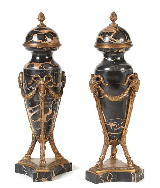 Appraisal: A pair of gilt bronze mounted marble table urns height