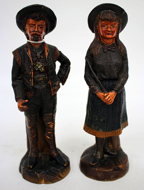 Appraisal: A PAIR OF POTTERY FIGURES Buffalo Bill and Annie Oakley