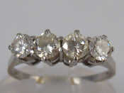 Appraisal: A white metal tests carat gold four stone diamond ring