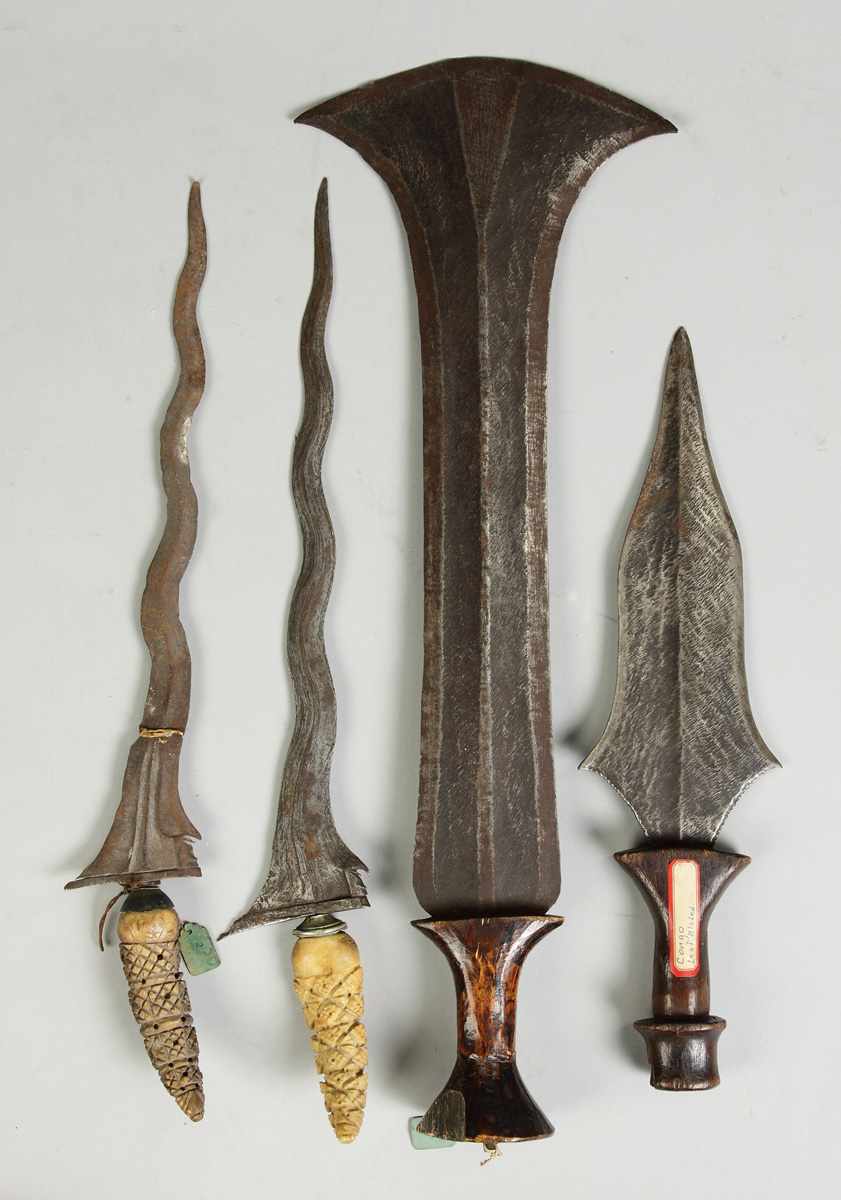 Appraisal: Knives daggers Left to right Indonesian Kriss Congo currency blade