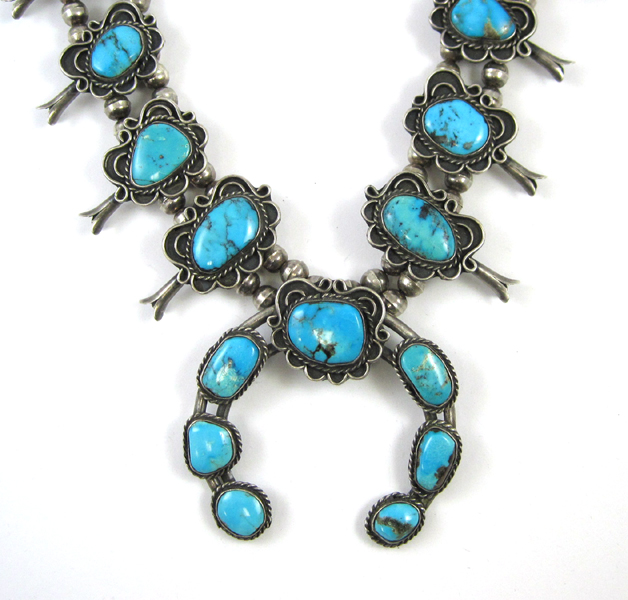 Appraisal: NAVAJO TURQUOISE SQUASH-BLOSSOM NECKLACE featuring ten squash blossom flowers and