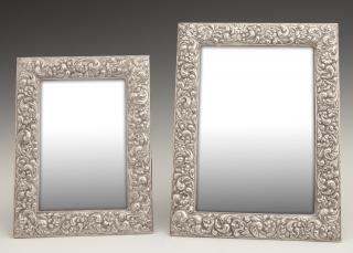 Appraisal: Two Sterling Silver Easel Picture Frames th c with repousse